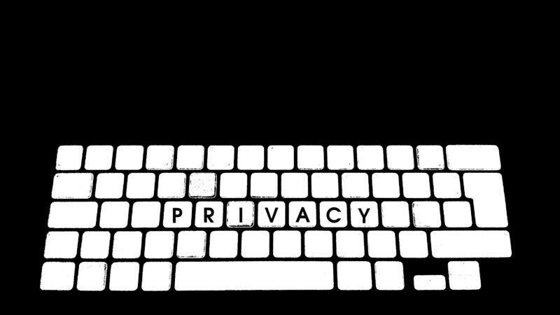 A white keyboard spelling out the word "privacy" against a black backdrop.