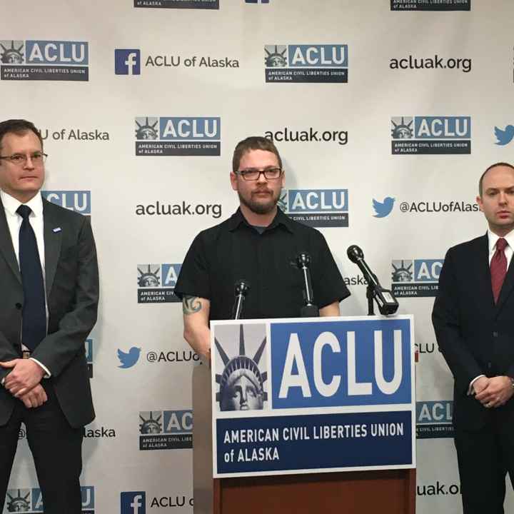 ACLU staff attorney Eric Glatt, plaintiff Lance Hunt, and executive director Joshua Decker at the press release announcing our KPB Lawsuit ACLU staff attorney Eric Glatt, plaintiff Lance Hunt, and executive director Joshua Decker stand in front of a podium